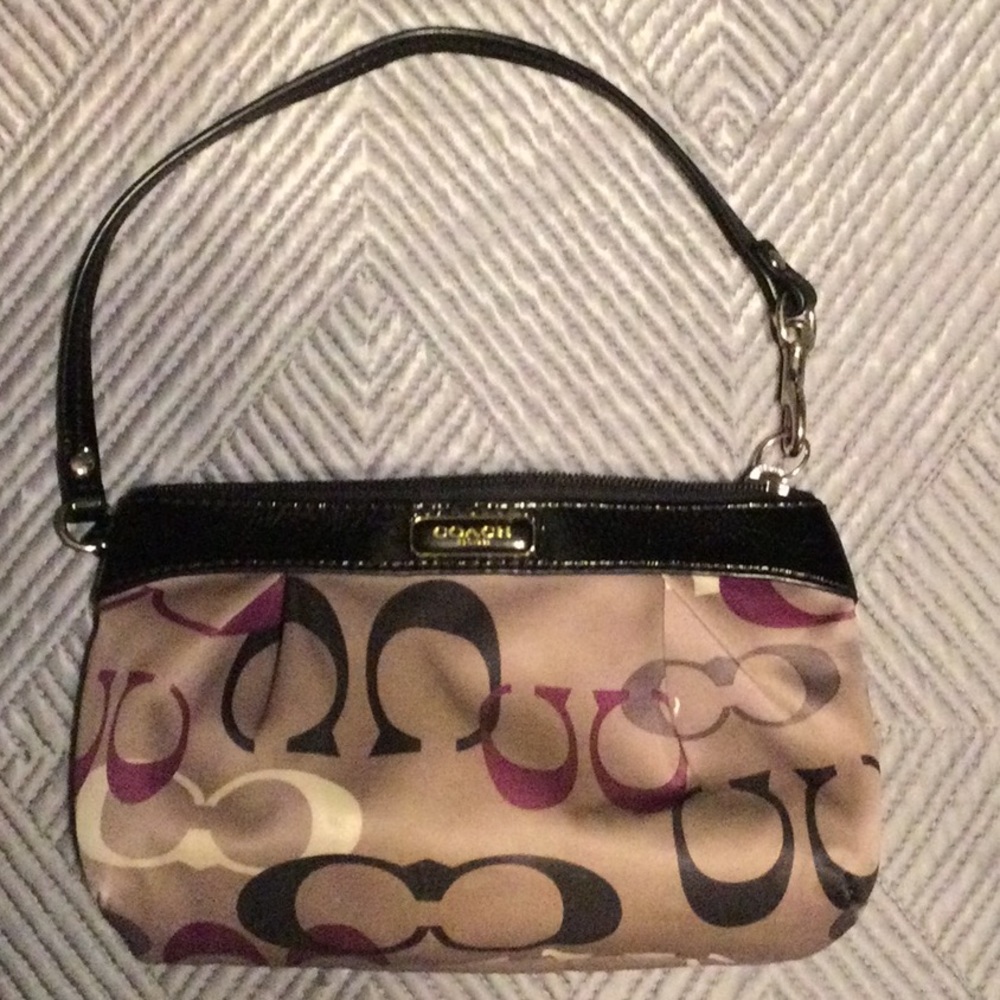 Coach tan and black wristlet for women